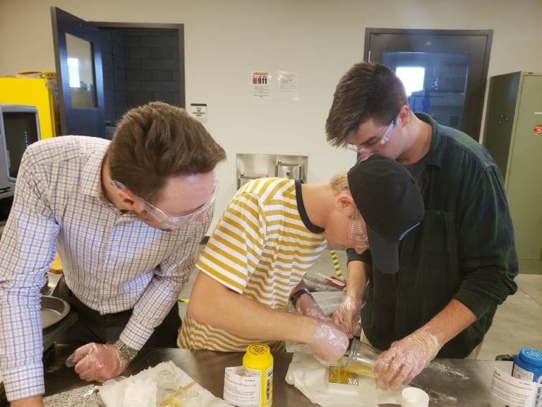 Pouring sample rubber into test mold. Jan. 2020