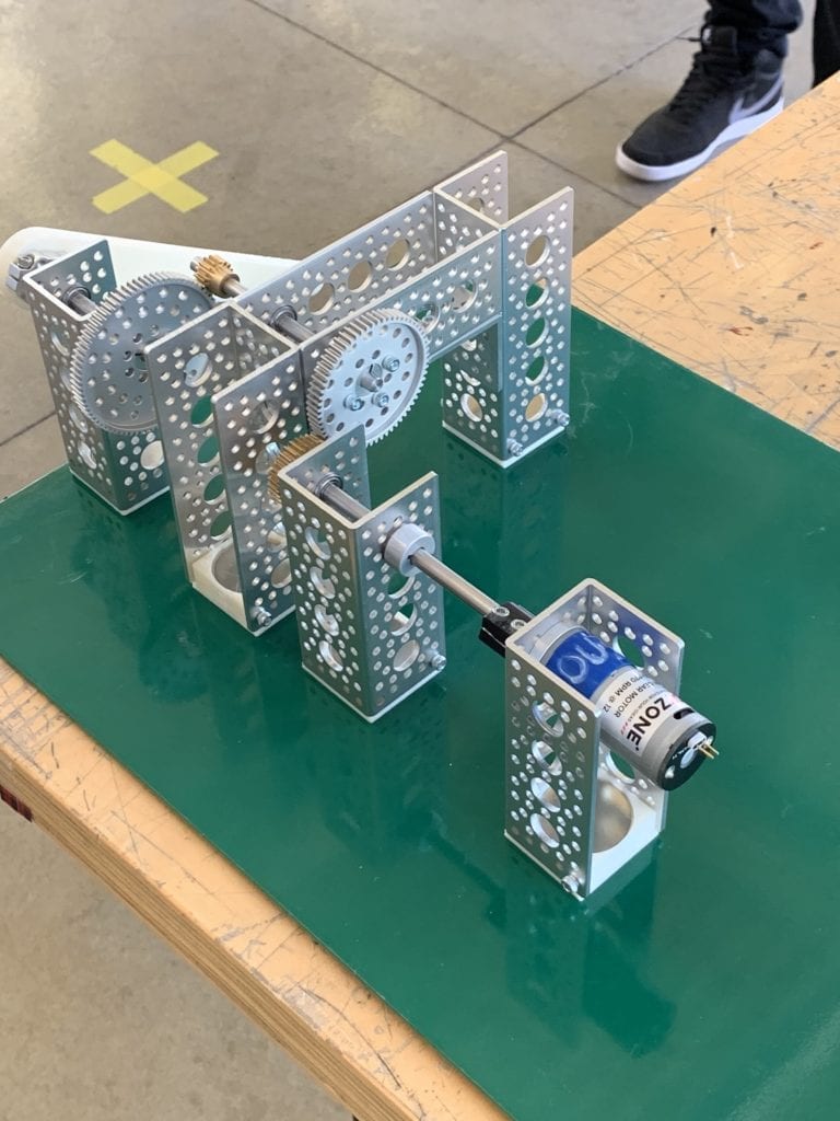 Gear configuration created by an ME student. the configuration uses six U channels and four gear with the input side of the configuration use the three D printed crank arm and the out put end of the configuration is connected to the 970 RPM motor.