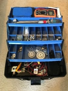 All components belonging to the exploratory lab and design lab fitting within the tackle box container.